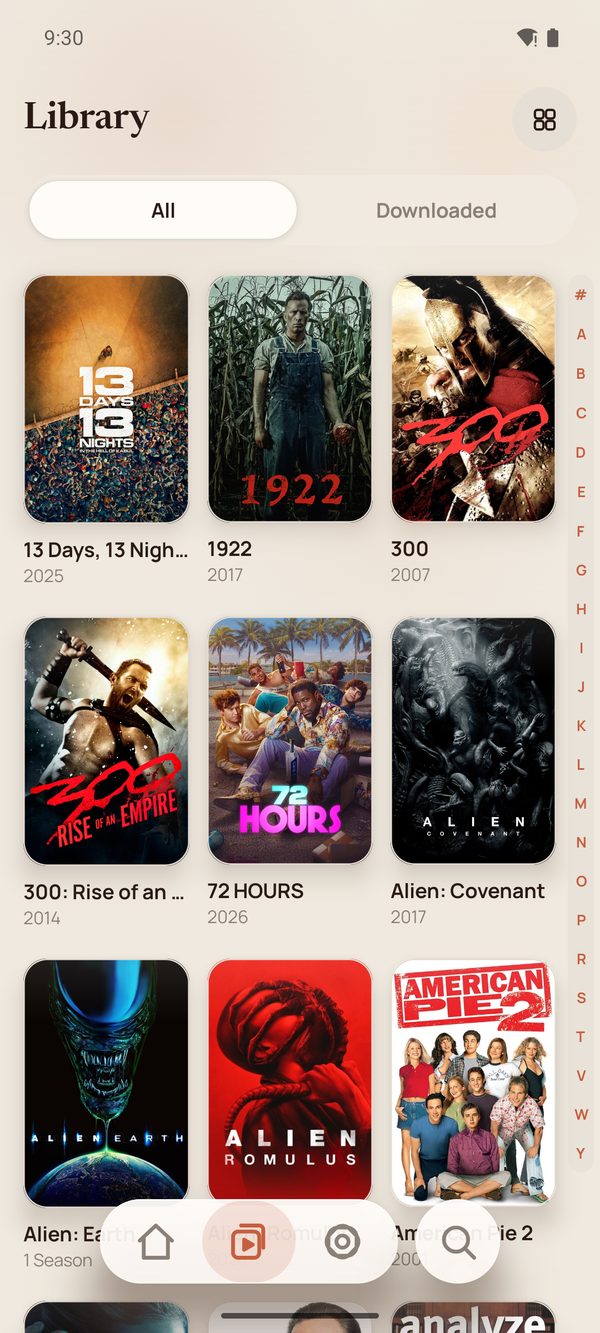 The Library tab showing a grid of film posters with an A to Z jump rail.